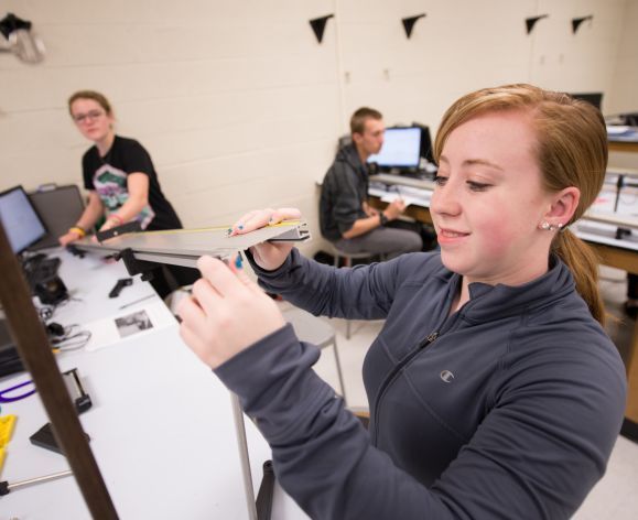 Students in engineering physics lab working on a motion project.