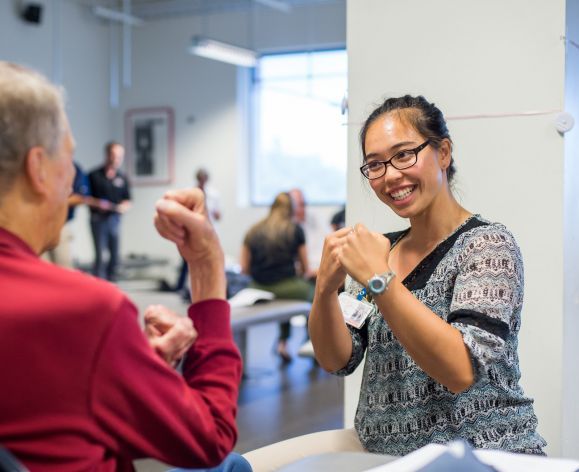 physical therapy student in clinic with patient