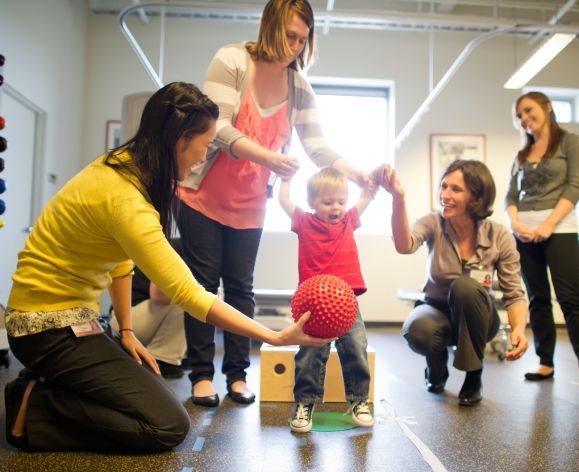 PT students working with child in clinic