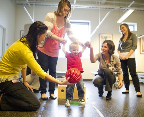 PT students working with child in clinic