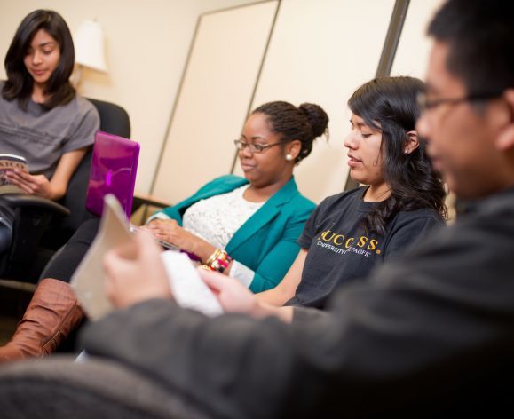 four students studying