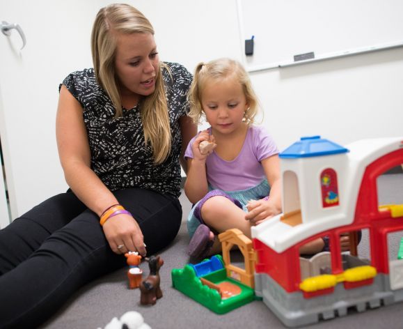 student working with child