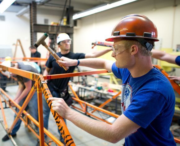 students working on bridge construction