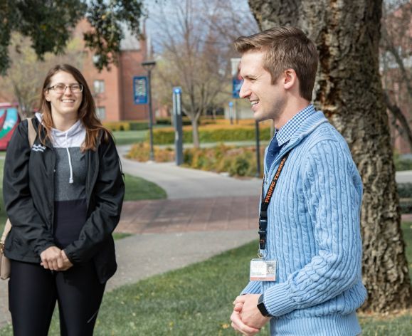 Staff member leads a campus tour