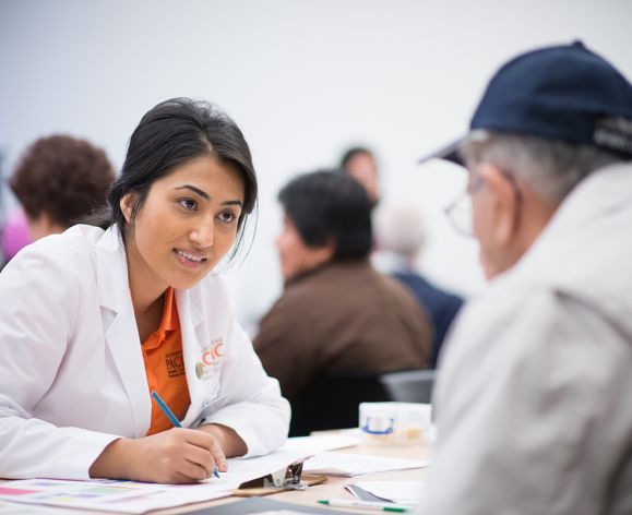 health sciences student talking with patient