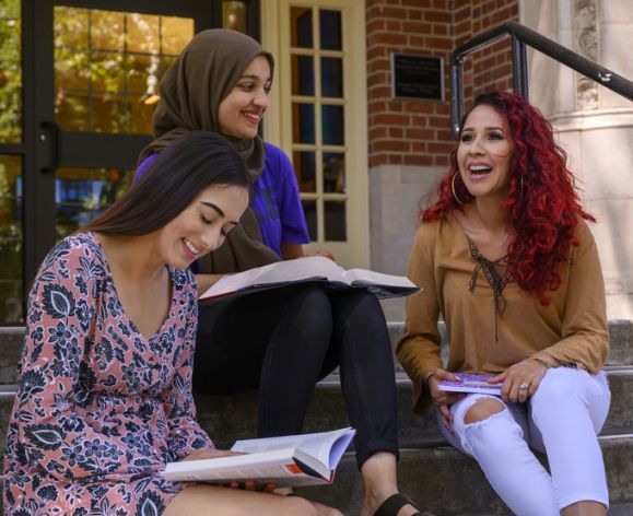 Sociology students Catalina Vasquez, left, with Brianna Rojas, right, and Rahila Shah