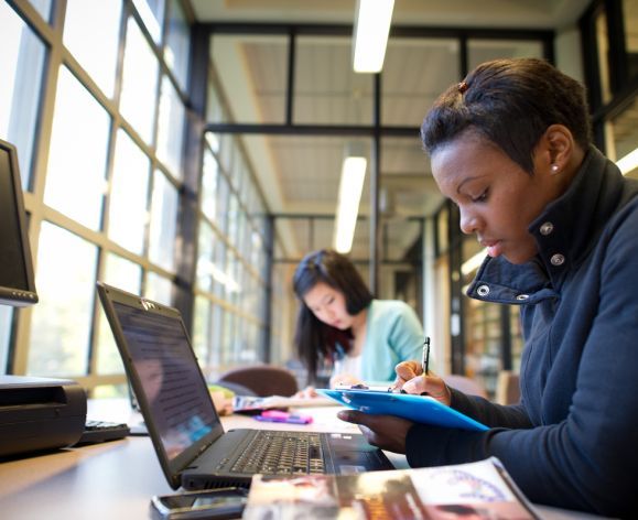 student studying on a laptop