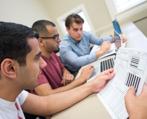 students looking through worksheets