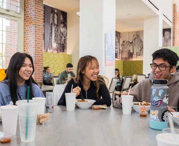 students enjoy lunch together