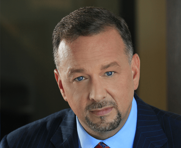 A close up portrait of a man in a suit 