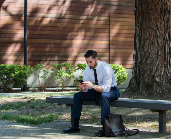 a man looks at his phone