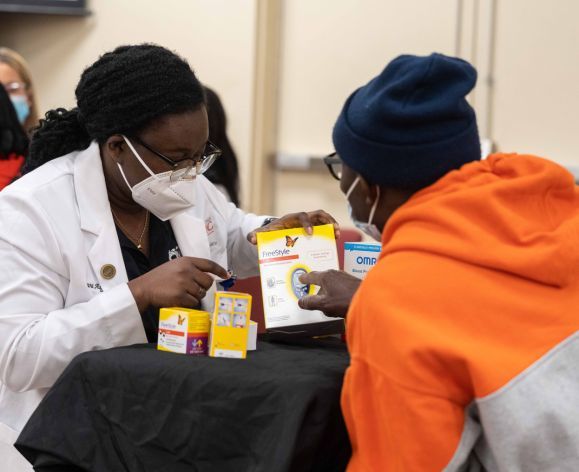 PharmD student with patient at Diabetes Care Clinic