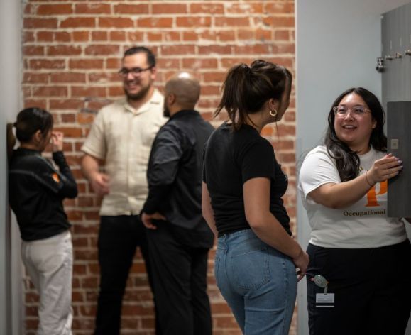 students talking in a hallway