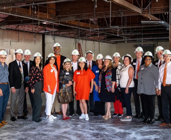 regents wearing hard hats touring the healthcare collaborative buildings