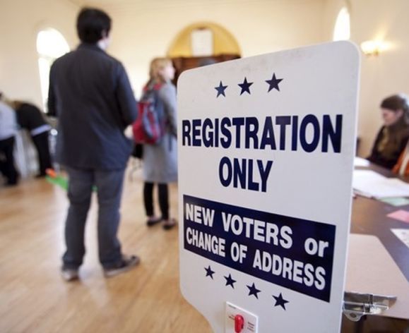 a sign saying "registration only, new voters or change of address"