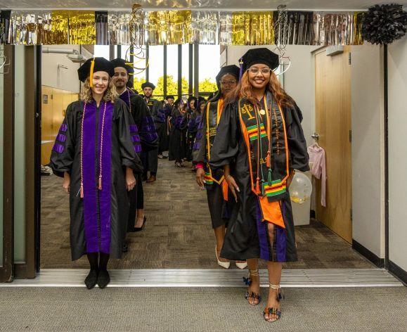 graduates standing in two lines